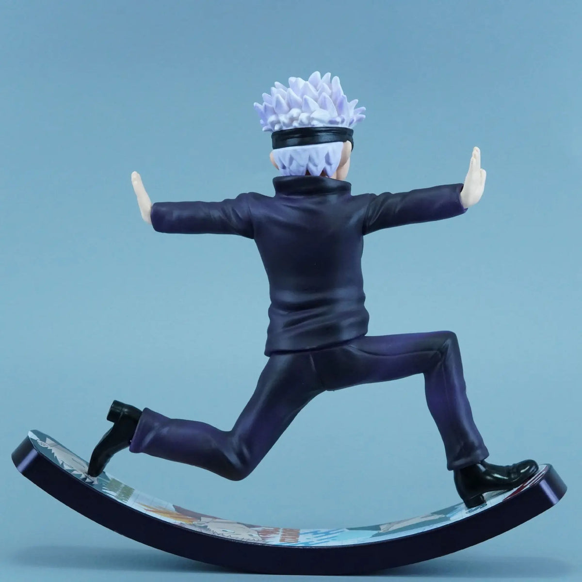 Action figure of a character in a dynamic pose on a blue background Jujutsu Kaisen Satoru Gojo Authentic 6.6-Inch Playful Swing PVC Figure – Kinetic Rocking Base & Joyful Blindfold Edition back