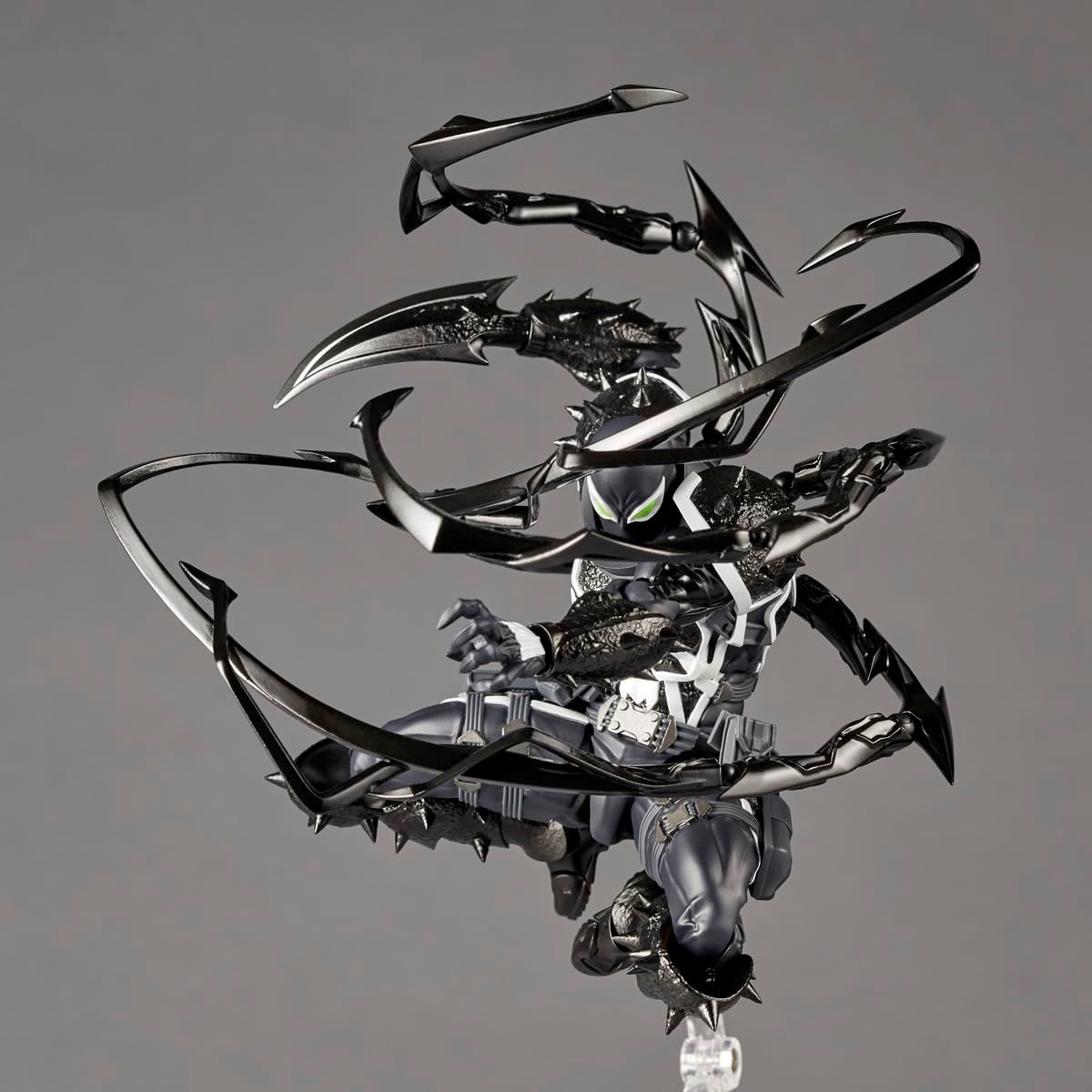 Metallic dragon sculpture on a reflective surface with a gray background Marvel Amazing Yamaguchi Revoltech Agent Venom Authentic Action Figure