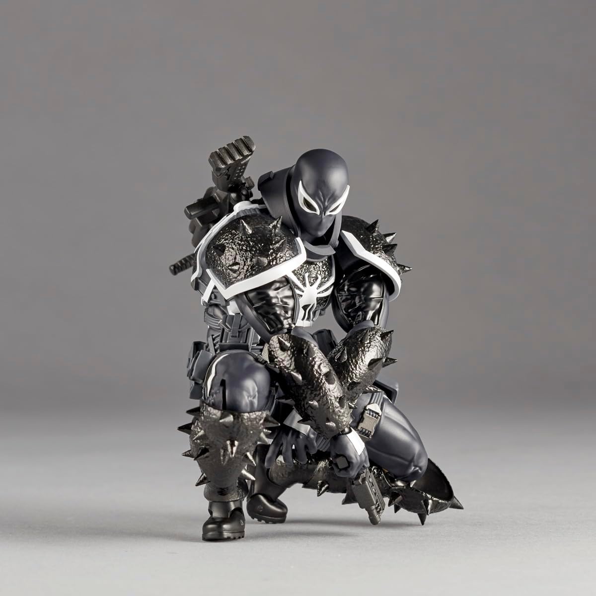 Action figure with detailed armor and weapons on a gray background Marvel Amazing Yamaguchi Revoltech Agent Venom Authentic Action Figure