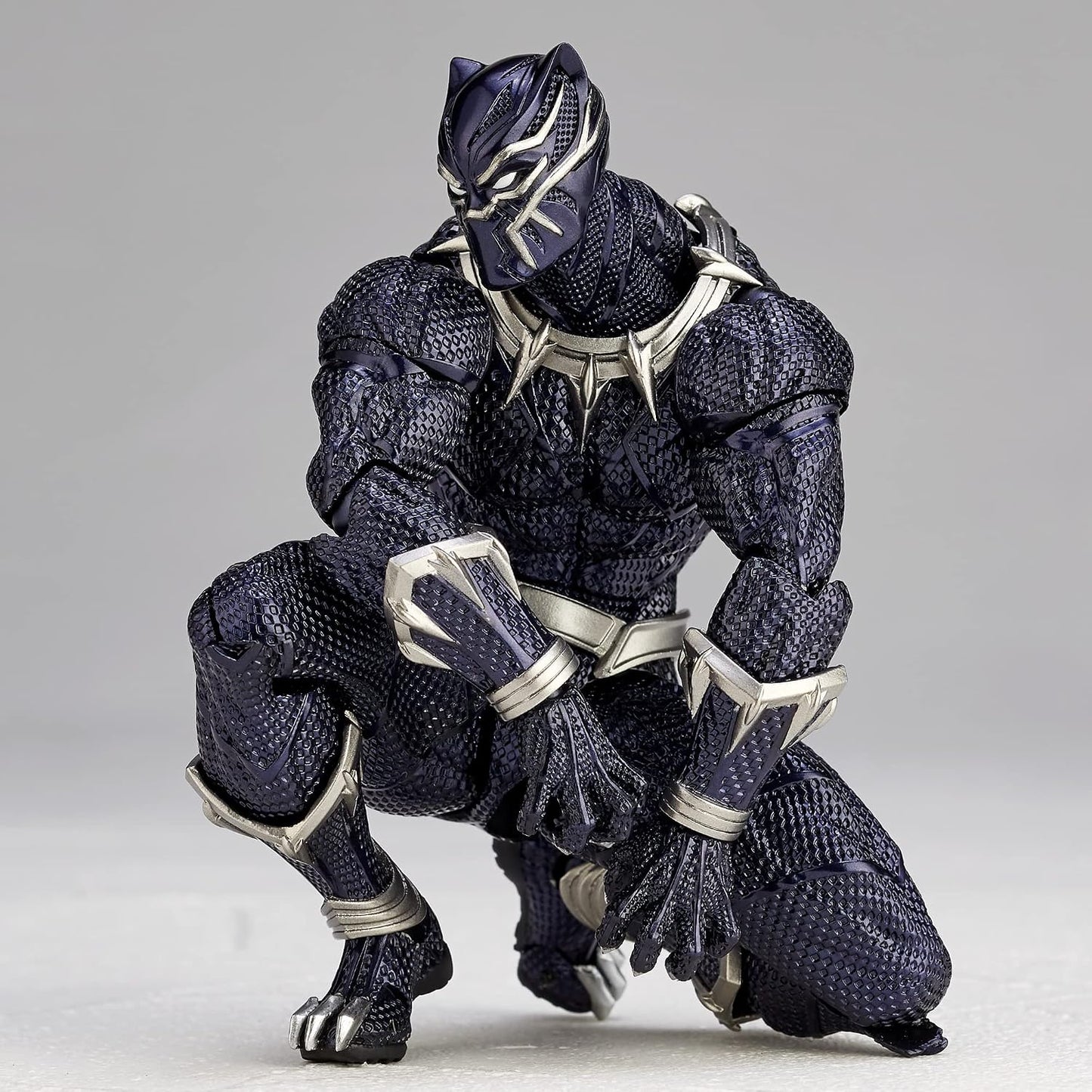 Black Panther action figure with a metallic suit on a gray background Marvel Amazing Yamaguchi Revoltech No.030 Black Panther Authentic Action Figure