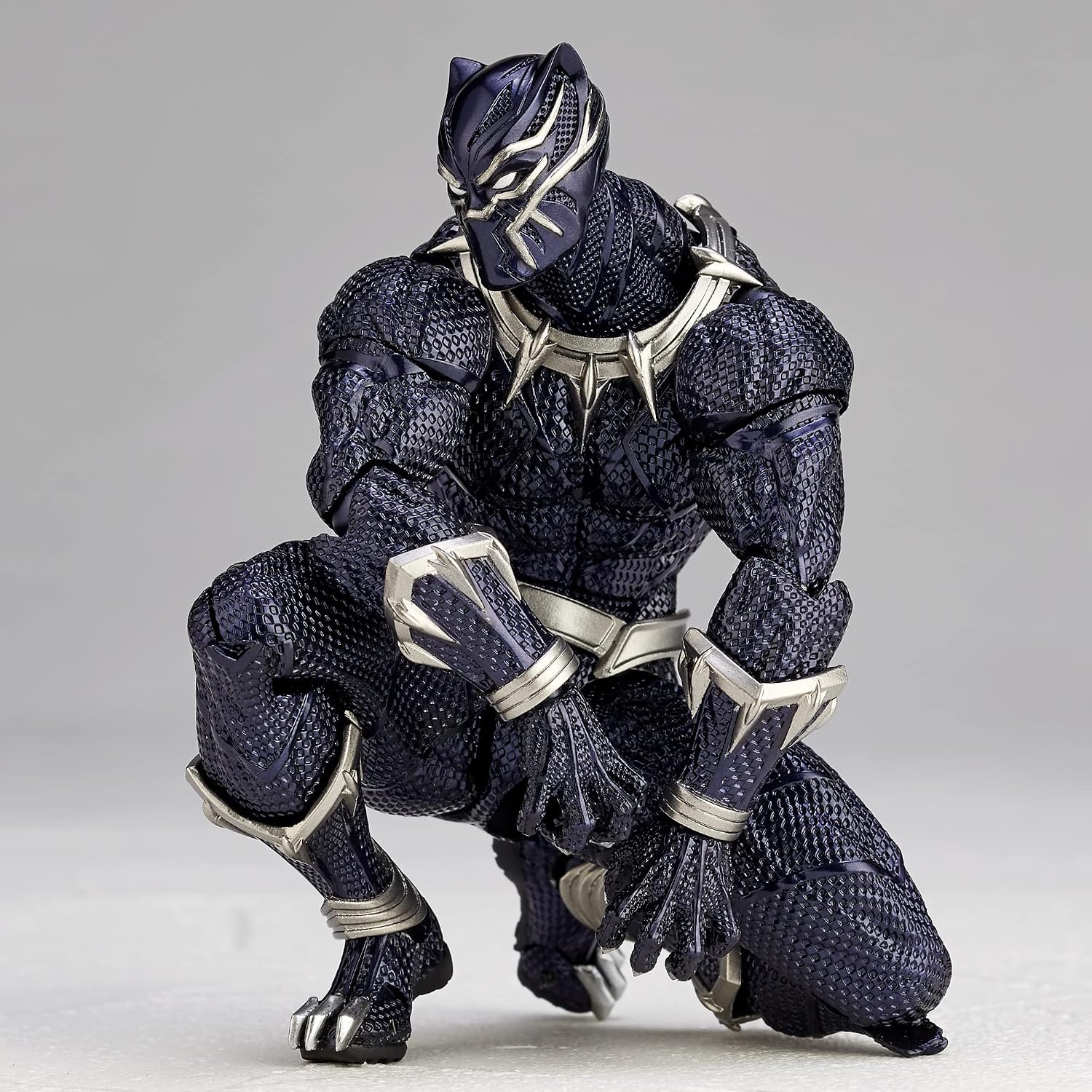 Black Panther action figure with a metallic suit on a gray background Marvel Amazing Yamaguchi Revoltech No.030 Black Panther Authentic Action Figure