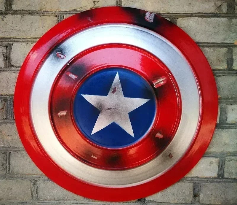 Red, white, and blue circular emblem with a star on a brick wall background Marvel Captain America 47.5cm Full Metal Prop Replica Shield