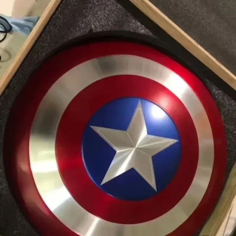 Close-up of a Captain America shield with red, blue, and silver colors. Marvel Captain America 47.5cm Full Metal Prop Replica Shield