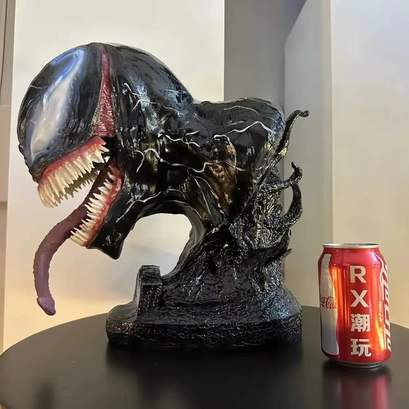 Large black alien-like creature figurine next to a red can of Coca-Cola on a reflective surface. Marvel Universe Venom 1:1 Scale Life-Size Premium Resin Collectible Bust