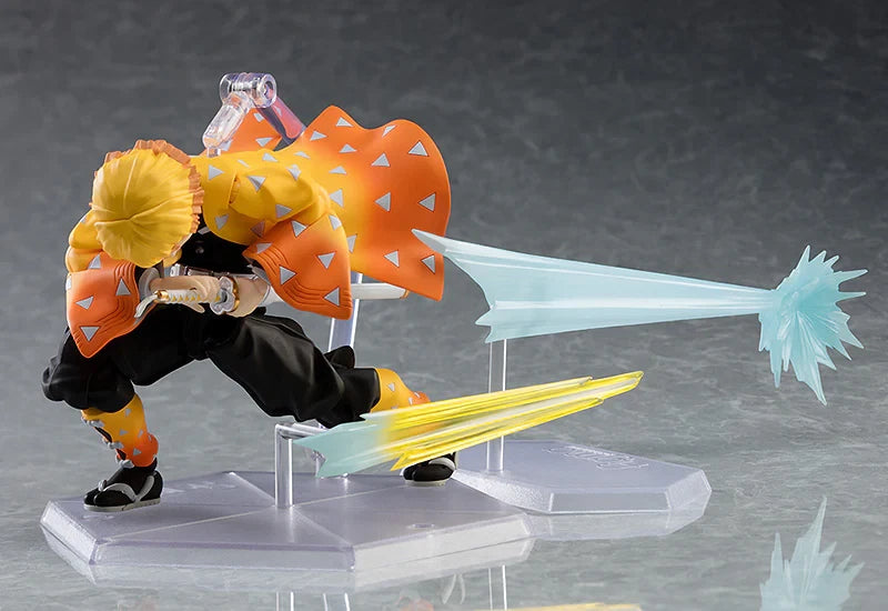 Action figure with large orange and yellow cape on a gray background