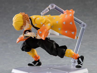 Action figure in dynamic pose with yellow and orange outfit on a gray background Max Factory figma Demon Slayer: Kimetsu no Yaiba: Zenitsu Agatsuma Authentic Premium Action Figure – Deluxe DX Edition