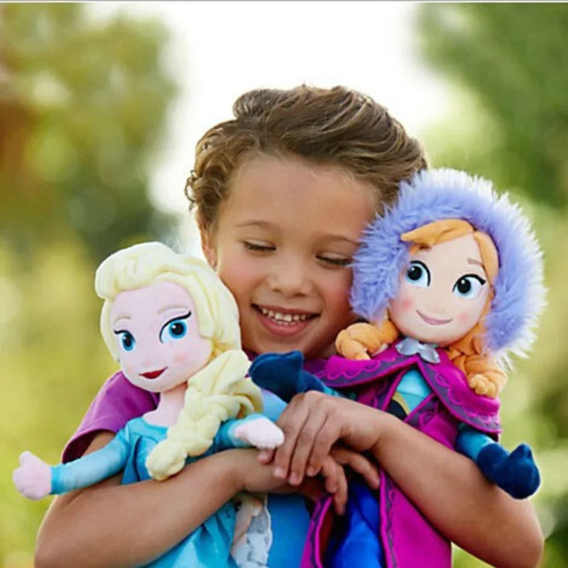Child holding two dolls resembling characters from a popular animated franchise outdoors. Official Disney Frozen Princess Anna Premium Cotton Plush by Titantoons – Available in 16-Inch & 20-Inch