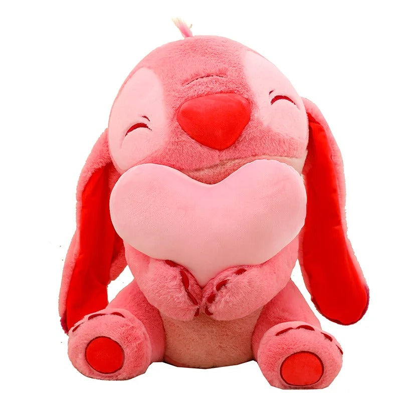 Pink plush toy with a heart design on a white background Official Disney Stitch & Angel Hugging Heart Premium Cotton Plush Set by Titantoons