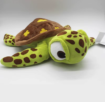 A plush sea turtle toy with a bright lime green body, dark brown spots, and a brown shell decorated with yellow flower shapes, shown on a plain white background. Official Finding Nemo Sea Turtle Premium Cotton Plush by Titantoons