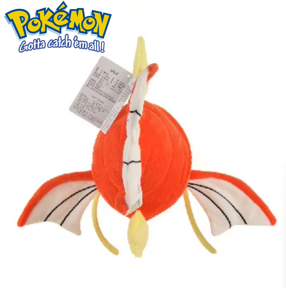 Plush toy of a dragon-like creature with a tag, featuring the Pokémon logo. Official Pokémon Magikarp Premium Cotton Plush by Titantoons – 11.5-Inch