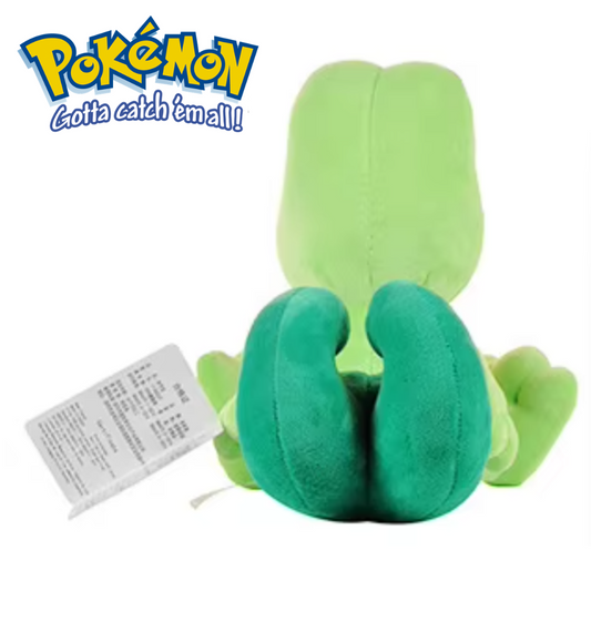 Green plush toy with a tag on a white background, featuring the Pokémon logo. Official Pokémon Treecko Premium Cotton Plush by Titantoons – 9.5-Inch