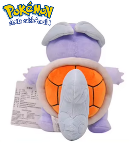 Plush toy of a purple creature with an orange shell, featuring the Pokémon logo. Official Pokémon Wartortle Premium Cotton Plush by Titantoons – 8.5-Inch