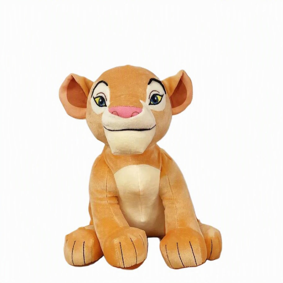 A plush lion cub toy with tan and cream fur, green eyes, and a pink nose, sitting against a plain white background. nala