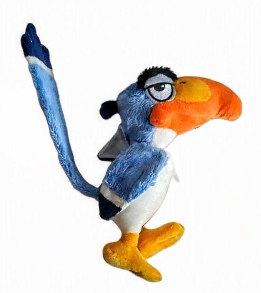 A plush toy of Zazu the hornbill from The Lion King, featuring blue feathers, a large orange beak, and yellow feet, set against a plain white background. Official The Lion King Zazu Premium Cotton Plush by Titantoons