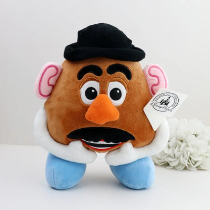 A plush toy of Mr. Potato Head, featuring a brown head, black hat and mustache, pink ears, blue feet, and a white collar, with a Disney tag attached. Official Toy Story Mr. & Mrs. Potato Head Premium Cotton Plush Collection by Titantoons