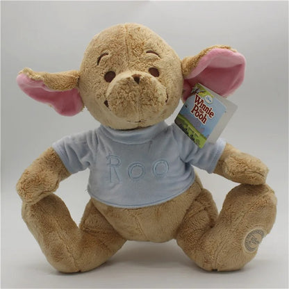 Plush toy resembling a monkey with a 'Winnie the Pooh' tag, wearing a shirt with 'Roo' on it. Official Winnie the Pooh & Friends Premium Cotton Plush Collection by Titantoons – Individual Storybook Characters or Complete 9-Piece Heirloom Nursery Set