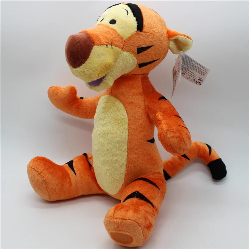 Plush toy resembling a tiger character with a tag on a white background. Official Winnie the Pooh & Friends Premium Cotton Plush Collection by Titantoons – Individual Storybook Characters or Complete 9-Piece Heirloom Nursery Set