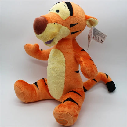 Plush toy resembling a tiger character with a tag on a white background. Official Winnie the Pooh & Friends Premium Cotton Plush Collection by Titantoons – Individual Storybook Characters or Complete 9-Piece Heirloom Nursery Set