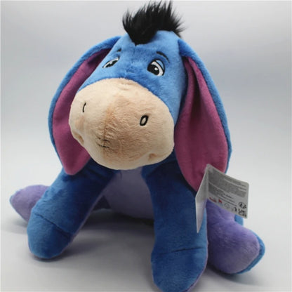 Plush toy resembling a donkey with purple ears on a light gray background. Official Winnie the Pooh & Friends Premium Cotton Plush Collection by Titantoons – Individual Storybook Characters or Complete 9-Piece Heirloom Nursery Set