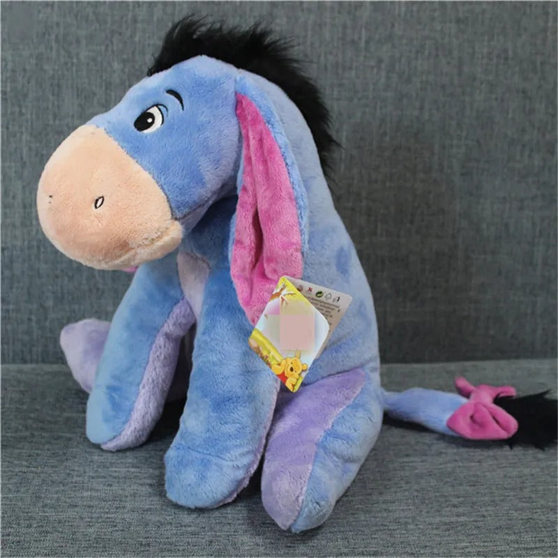 Plush toy resembling a donkey with a pink inner ear on a gray background. Official Winnie the Pooh & Friends Premium Cotton Plush Collection by Titantoons – Individual Storybook Characters or Complete 9-Piece Heirloom Nursery Set