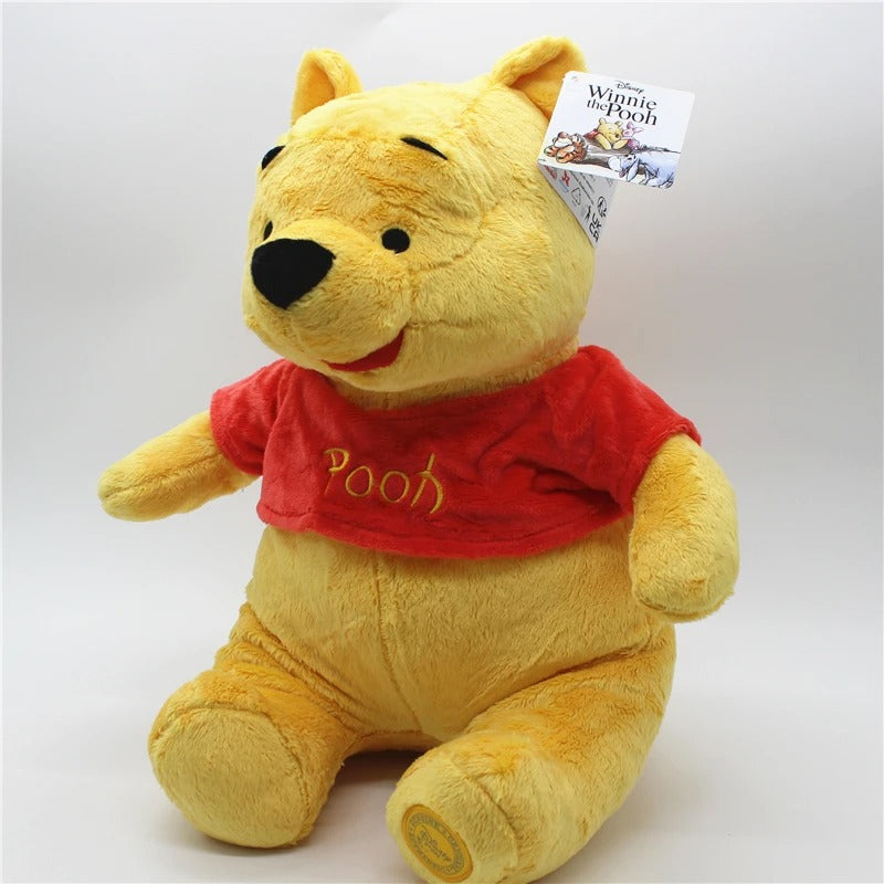 Plush toy bear wearing a red shirt with 'Pooh' text, on a white background. Official Winnie the Pooh & Friends Premium Cotton Plush Collection by Titantoons