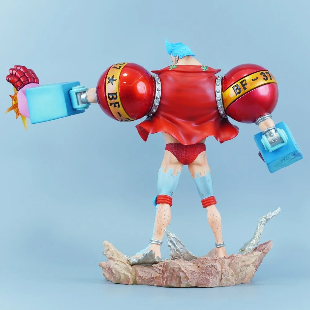 Colorful figurine with red and blue accents on a light blue background One Piece: "Cyborg" Franky New World Deluxe 11.22-Inch Premium PVC Exhibition Scale Statue (Radical Beam & Dual Hair Option Edition)