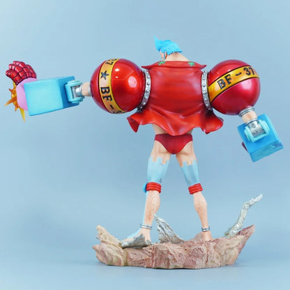 Colorful figurine with red and blue accents on a light blue background One Piece: "Cyborg" Franky New World Deluxe 11.22-Inch Premium PVC Exhibition Scale Statue (Radical Beam & Dual Hair Option Edition)