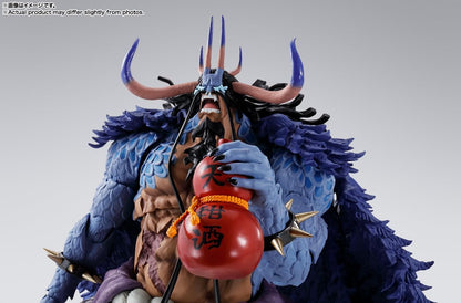 Detailed figurine with blue fur and red object on a gray background One Piece: Kaido - King of the Beasts (Man-Beast Form) Authentic S.H. Figuarts Colossal Fully Articulated Action Figure by Bandai Spirits