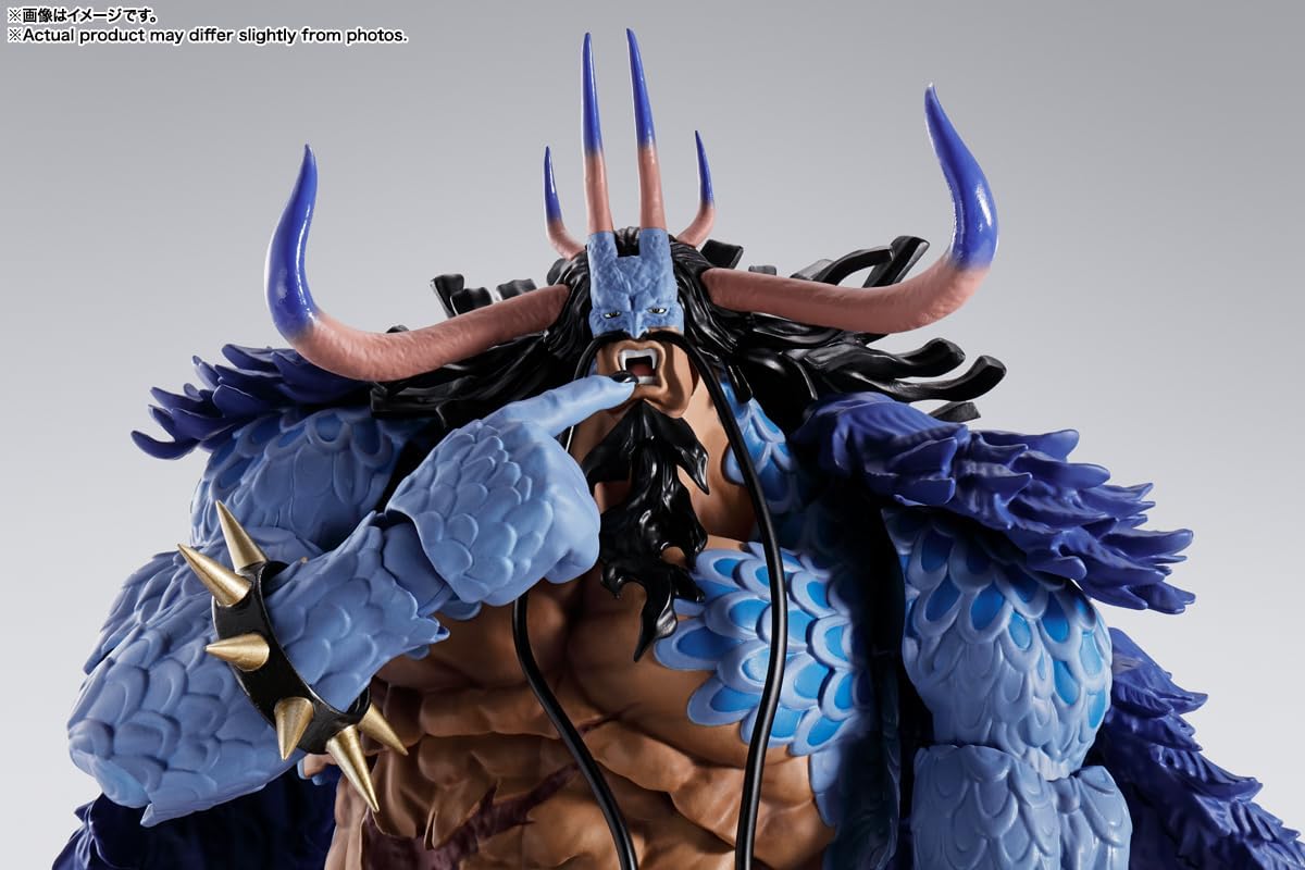 Close-up of a detailed figurine with blue and brown colors on a gray background One Piece: Kaido - King of the Beasts (Man-Beast Form) Authentic S.H. Figuarts Colossal Fully Articulated Action Figure by Bandai Spirits