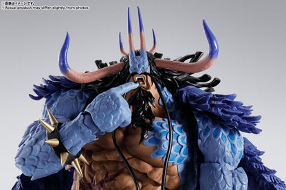 Close-up of a detailed figurine with blue and brown colors on a gray background One Piece: Kaido - King of the Beasts (Man-Beast Form) Authentic S.H. Figuarts Colossal Fully Articulated Action Figure by Bandai Spirits
