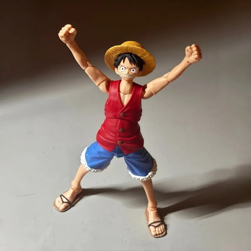 Action figure of a character in a red vest and blue shorts with a straw hat on a gray background One Piece: Monkey D. Luffy (Romance Dawn Ver.) Authentic S.H. Figuarts Fully Articulated Action Figure by Bandai Spirits