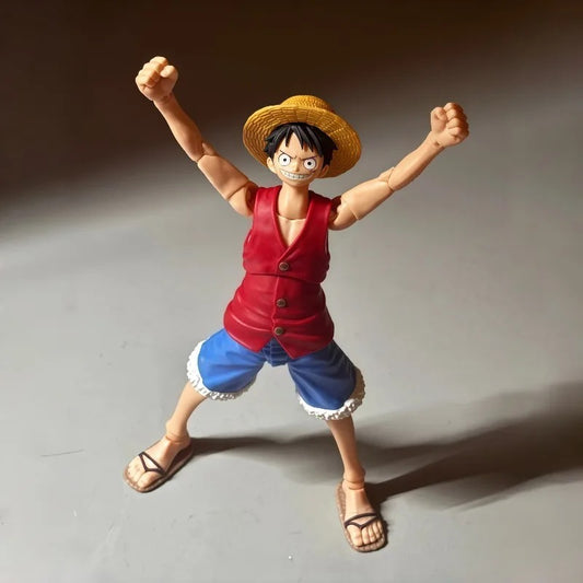 Action figure of a character in a red vest and blue shorts with a straw hat on a gray background One Piece: Monkey D. Luffy (Romance Dawn Ver.) Authentic S.H. Figuarts Fully Articulated Action Figure by Bandai Spirits