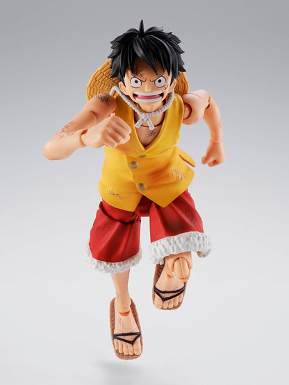 Action figure of a character in a yellow shirt and red shorts on a gray background One Piece: Monkey D. Luffy (Summit War of Marineford Ver.) Authentic S.H. Figuarts Fully Articulated Action Figure by Bandai Spirits