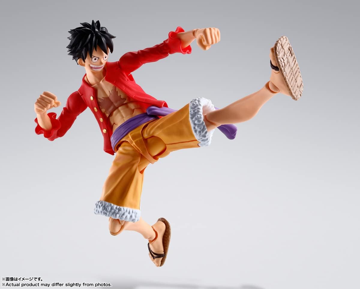 Action figure of a character in a dynamic pose on a gray background One Piece: Monkey D. Luffy (The Raid on Onigashima Ver.) Authentic S.H. Figuarts Fully Articulated Action Figure by Bandai Spirits