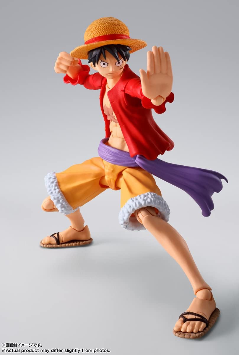 Action figure of a character from a popular anime series on a gray background One Piece: Monkey D. Luffy (The Raid on Onigashima Ver.) Authentic S.H. Figuarts Fully Articulated Action Figure by Bandai Spirits