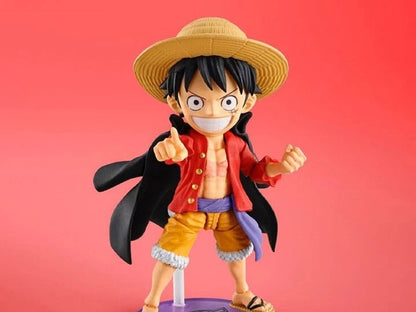 Figurine of a character with a straw hat and red jacket on a red background One Piece: Monkey D. Luffy (WCF x S.H. Figuarts Ver.) Authentic Fully Articulated Chibi Action Figure by Bandai Spirits 