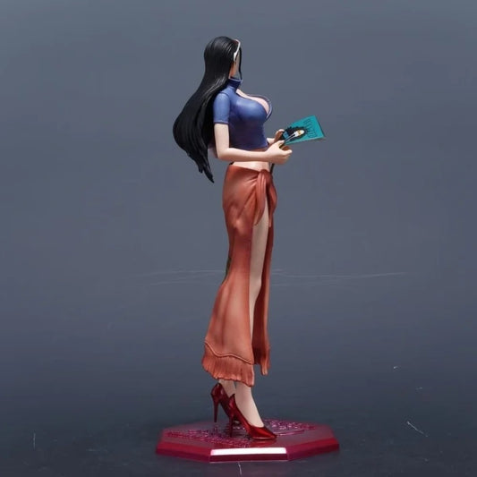 Figurine of a character with long black hair, blue top, and orange skirt holding a green object on a dark background. One Piece: Nico Robin Authentic 1/6 Scale Complete Painted Garage Kit Statue (D.S Studio Limited Sale Standard Version)