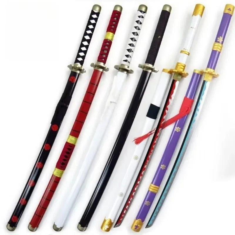 Set of decorative swords with various designs on a white background One Piece: Roronoa Zoro 41-Inch Authentic Replica Bamboo Katana