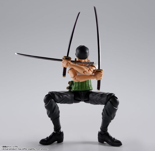 Action figure with two swords on a gray background One Piece: Roronoa Zoro (Romance Dawn Ver.) Authentic S.H. Figuarts Fully Articulated Action Figure by Bandai Spirits