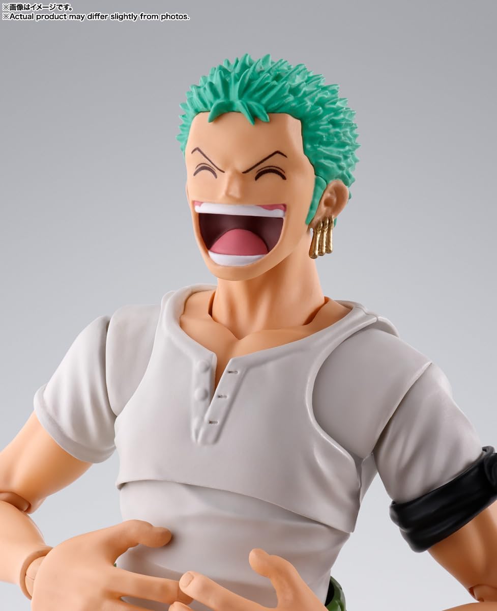 Action figure with green hair and a gray outfit on a gray background One Piece: Roronoa Zoro (Romance Dawn Ver.) Authentic S.H. Figuarts Fully Articulated Action Figure by Bandai Spirits