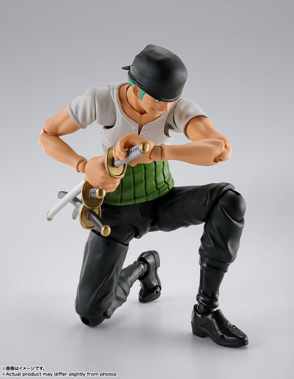 Action figure in dynamic pose with a sword on a gray background One Piece: Roronoa Zoro (Romance Dawn Ver.) Authentic S.H. Figuarts Fully Articulated Action Figure by Bandai Spirits