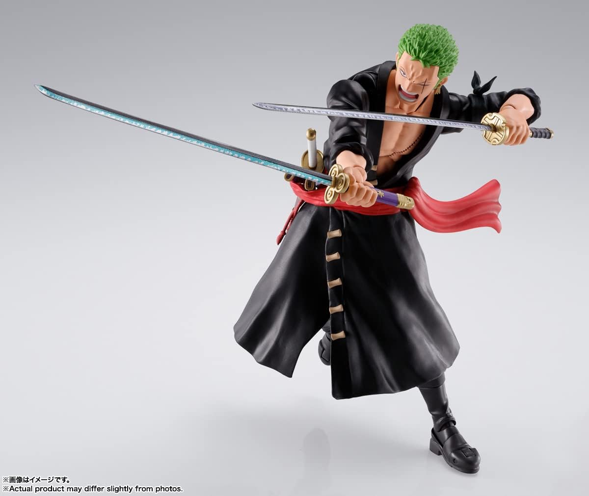 Action figure of a character from an anime with a sword and cape on a gray background One Piece: Roronoa Zoro (The Raid on Onigashima Ver.) Authentic S.H. Figuarts Fully Articulated Action Figure by Bandai Spirits