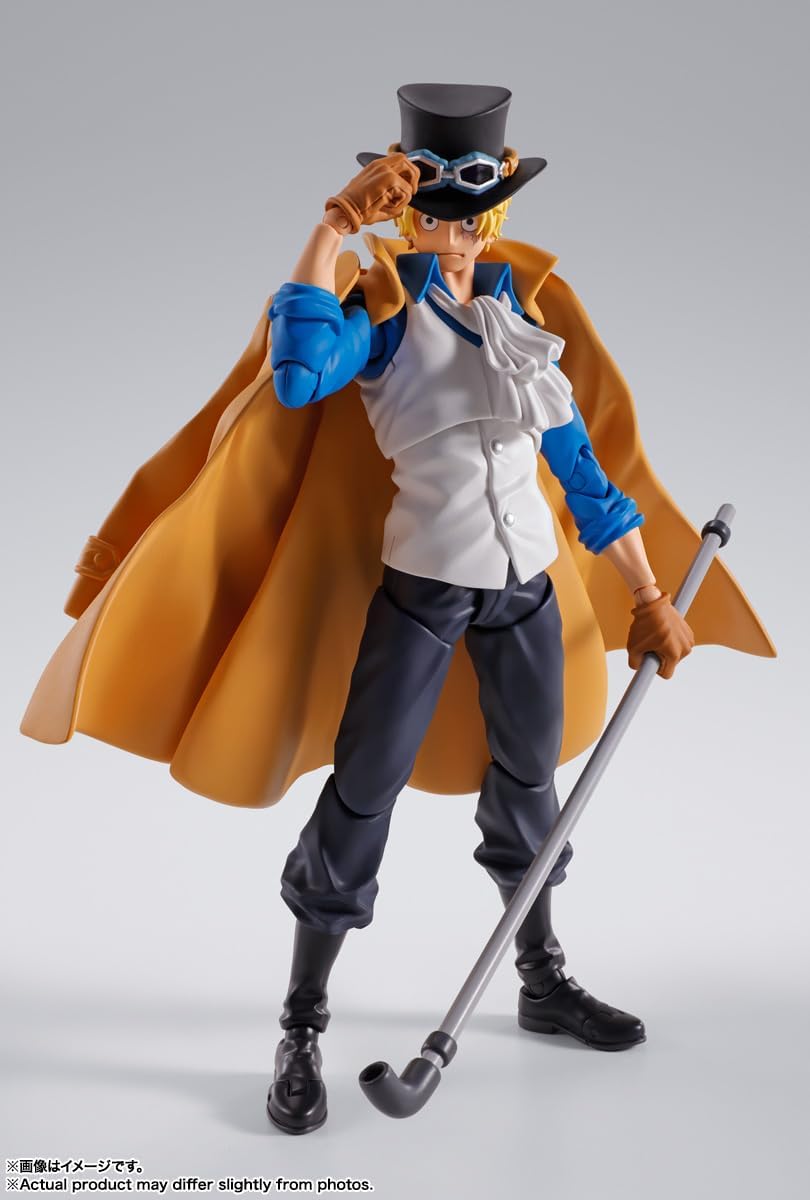 Action figure of a character with a top hat, cane, and orange cape on a gray background One Piece: Sabo (Revolutionary Army Chief of Staff Ver.) Authentic S.H. Figuarts Fully Articulated Action Figure by Bandai Spirits