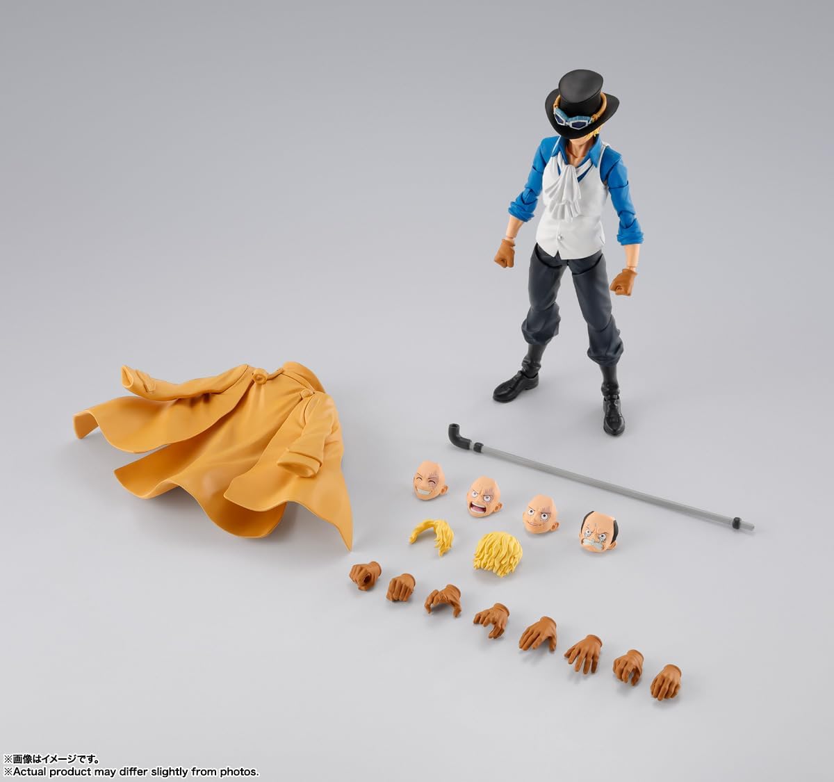 Action figure with interchangeable parts on a gray background One Piece: Sabo (Revolutionary Army Chief of Staff Ver.) Authentic S.H. Figuarts Fully Articulated Action Figure by Bandai Spirits