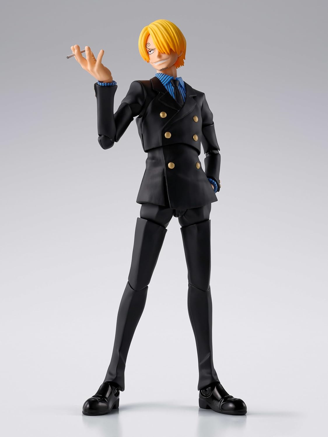 Action figure in a black suit with yellow hair on a gray background One Piece: Sanji (Romance Dawn Ver.) Authentic S.H. Figuarts Fully Articulated Action Figure by Bandai Spirits