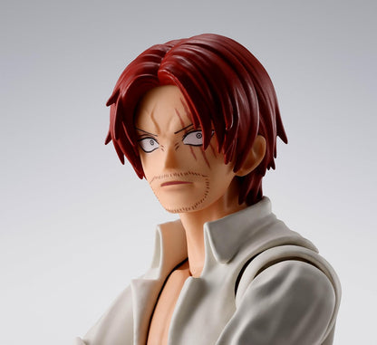 Figurine of a character with red hair and a white outfit on a gray background One Piece: Shanks & Monkey D. Luffy (Childhood Ver.) Authentic S.H. Figuarts Fully Articulated Twin-Pack Action Figure Set by Bandai Spirits