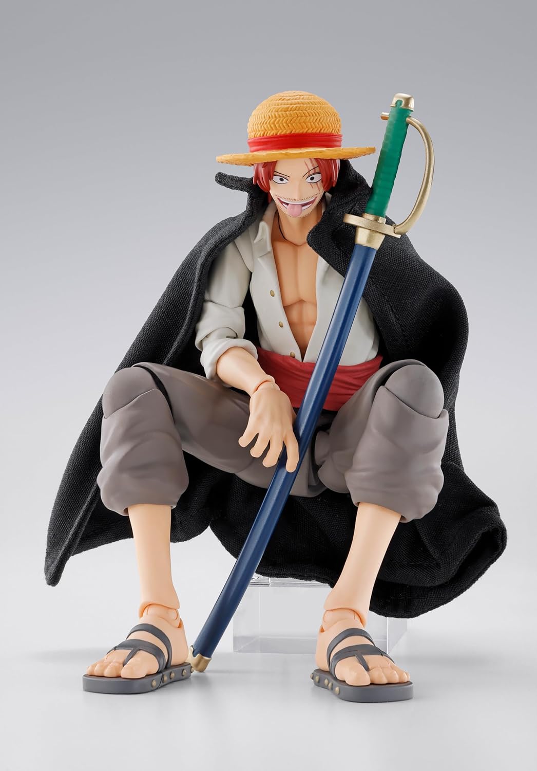 Action figure of a character from a popular anime series holding a large sword on a gray background One Piece: Shanks & Monkey D. Luffy (Childhood Ver.) Authentic S.H. Figuarts Fully Articulated Twin-Pack Action Figure Set by Bandai Spirits