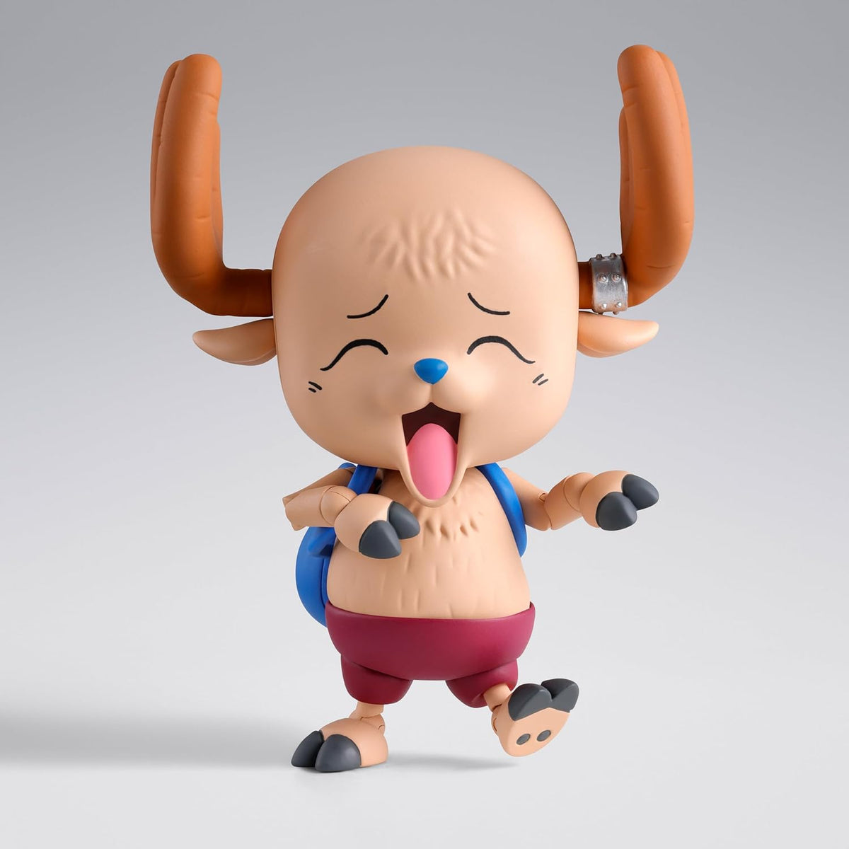 Animated character figurine with large horns on a gray background One Piece: Tony Tony Chopper (Drum Island Ver.) Authentic S.H. Figuarts Fully Articulated Action Figure by Bandai Spirits
