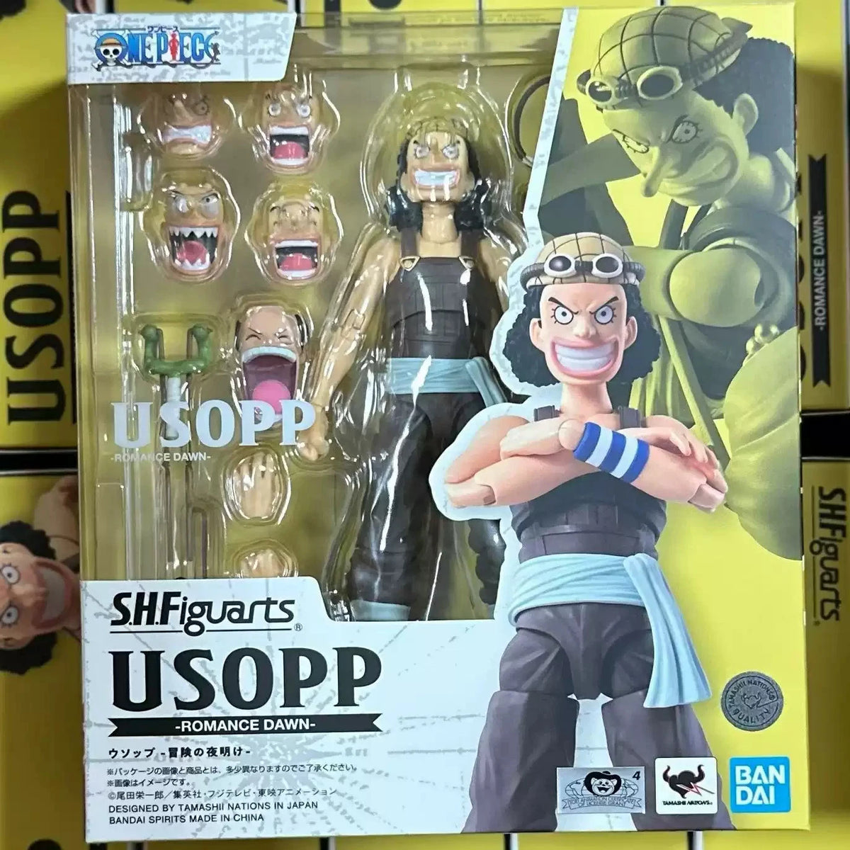 SHFiguarts Usopp action figure packaging with character illustration on a yellow background One Piece: Usopp (Romance Dawn Ver.) Authentic S.H. Figuarts Fully Articulated Action Figure by Bandai Spirits