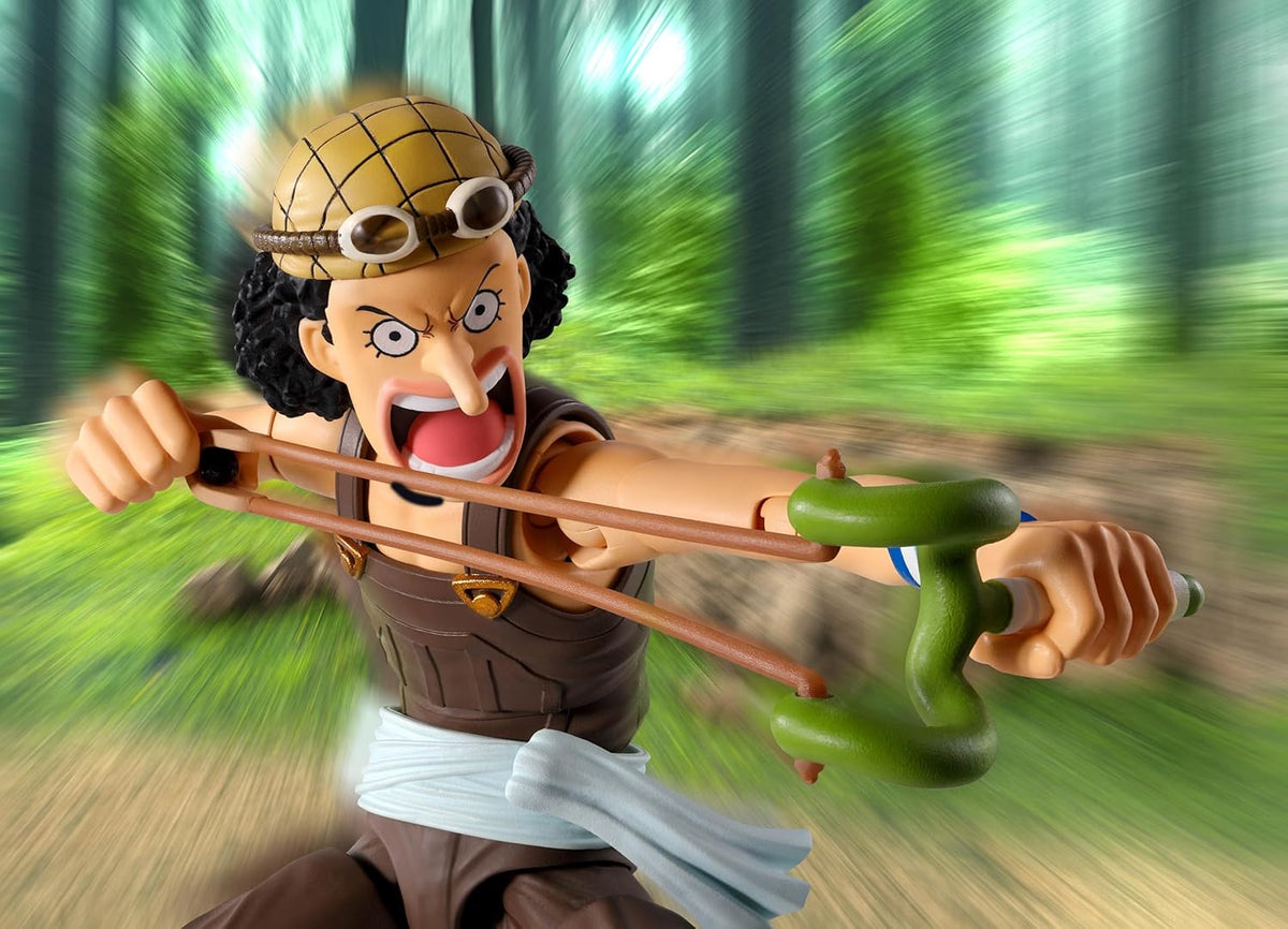Toy figure of a character with a bow and arrow in a forest setting One Piece: Usopp (Romance Dawn Ver.) Authentic S.H. Figuarts Fully Articulated Action Figure by Bandai Spirits
